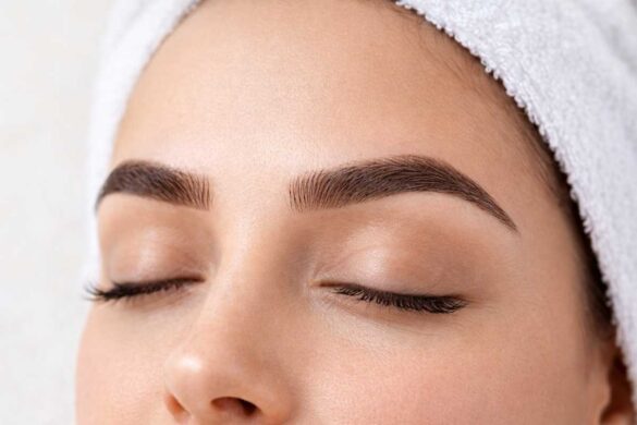 Close-up of microbladed eyebrows with a clean aesthetic background